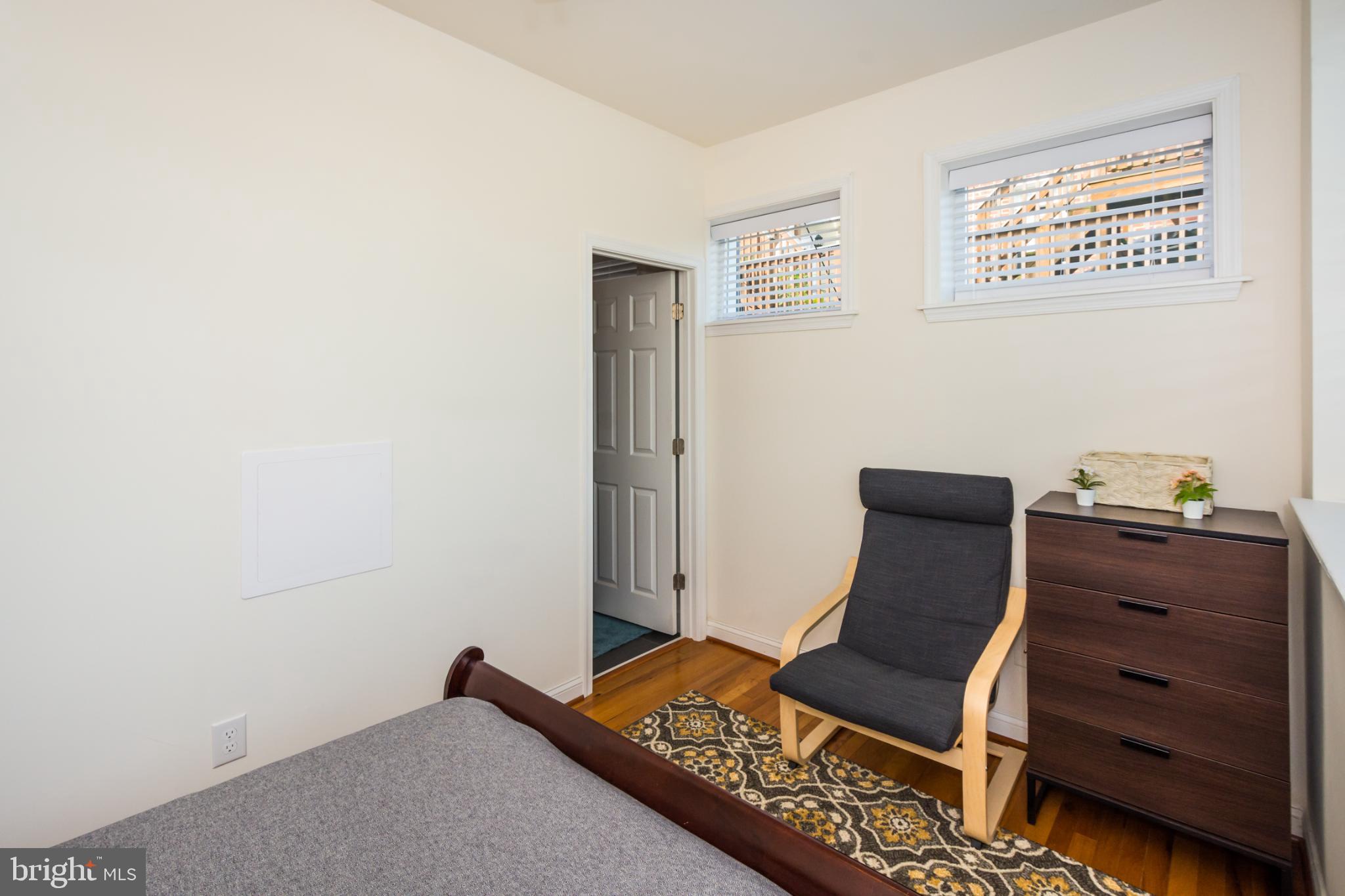 600 South Linwood Avenue, Unit A Baltimore, MD 21224 - Photo 20 of 33 a living room with furniture and a baby crib