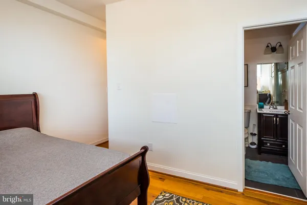 a bedroom with a bed and a view of bedroom