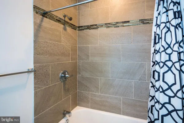 a bathroom with a shower and a shower