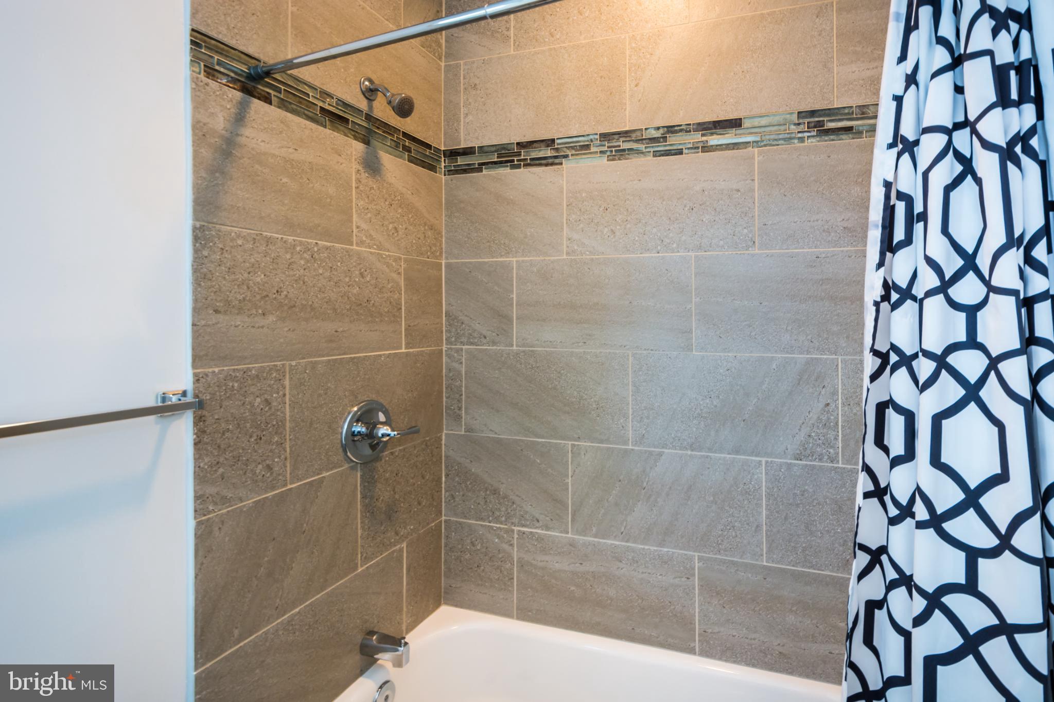 600 South Linwood Avenue, Unit A Baltimore, MD 21224 - Photo 24 of 33 a bathroom with a shower and a shower