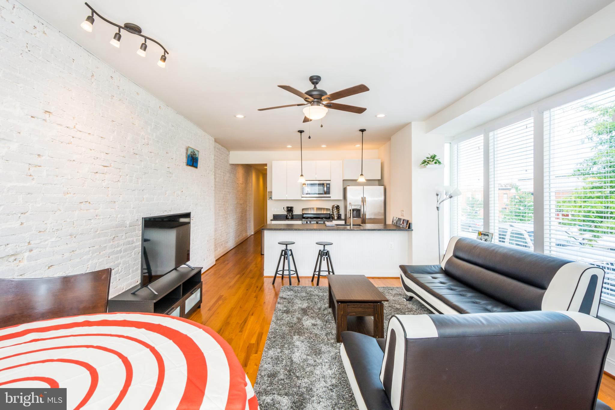 600 South Linwood Avenue, Unit A Baltimore, MD 21224 - Photo 6 of 33 a living room with furniture and a fireplace