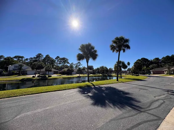 a view of a street with houses on the side