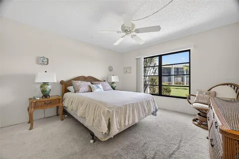 a bedroom with a bed furniture and a window