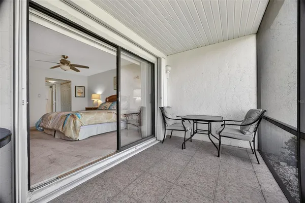 a view of a livingroom with furniture and a window