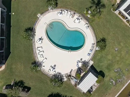 an aerial view of a house with outdoor space