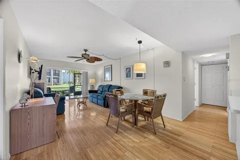 a view of a livingroom with furniture and wooden floor