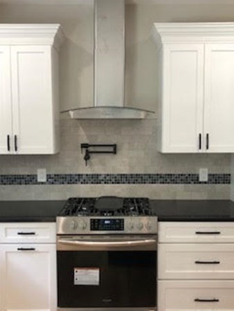 49 Ridge View Road Northampton, MA 01062 - Photo 13 of 32 a kitchen with a stove and a refrigerator