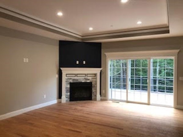49 Ridge View Road Northampton, MA 01062 - Photo 8 of 32 a view of an empty room with a fireplace and a window