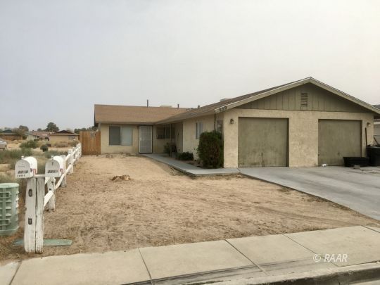 220 South Valley Street Ridgecrest, CA 93555 - Photo 1 of 17 a view of a house with a backyard