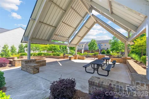 a view of a backyard with sitting area