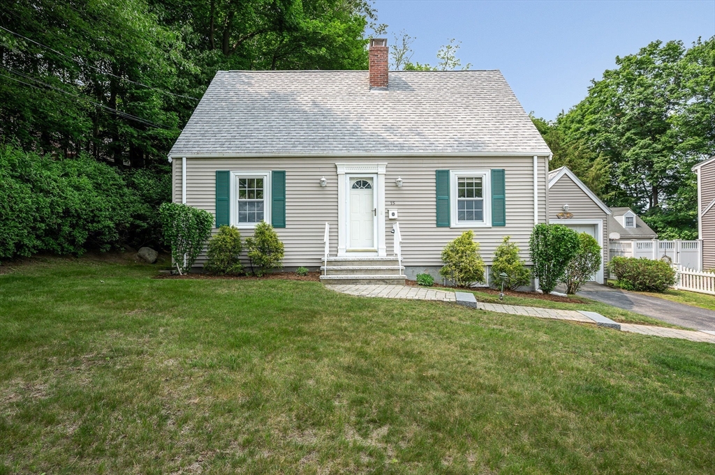 a view of a house with garden and yard