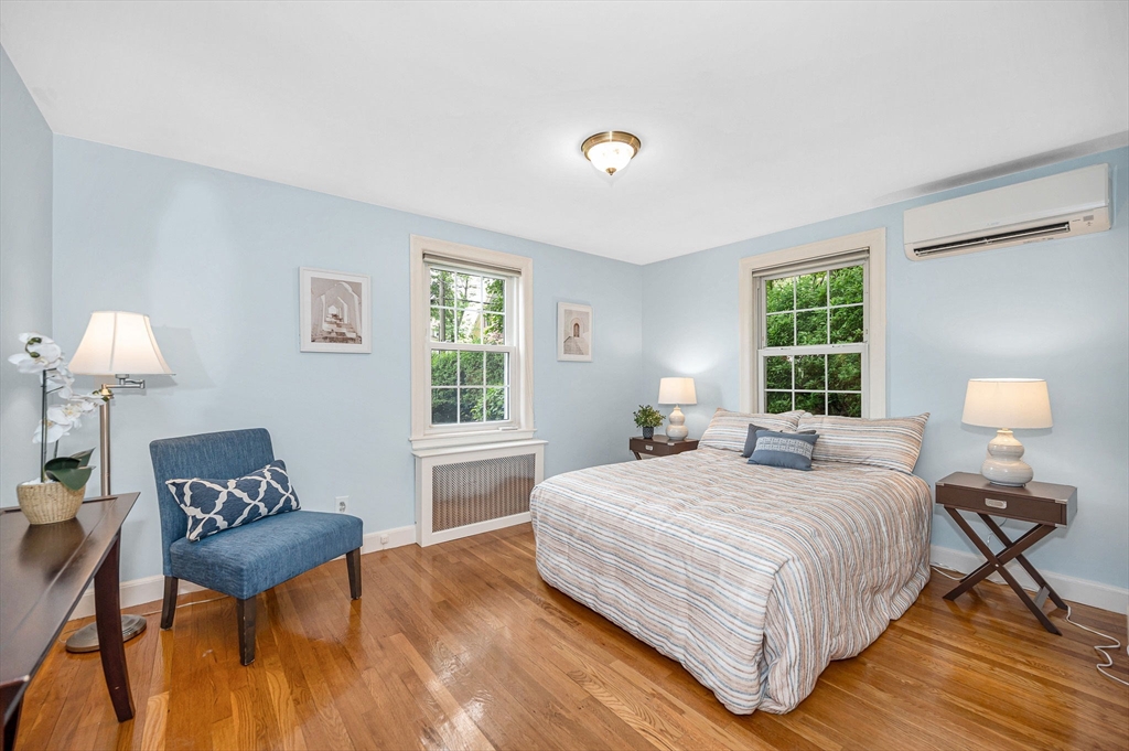 15 Eustis Avenue Wakefield, MA 01880 - Photo 12 of 42 a bedroom with a bed and a table in it with window
