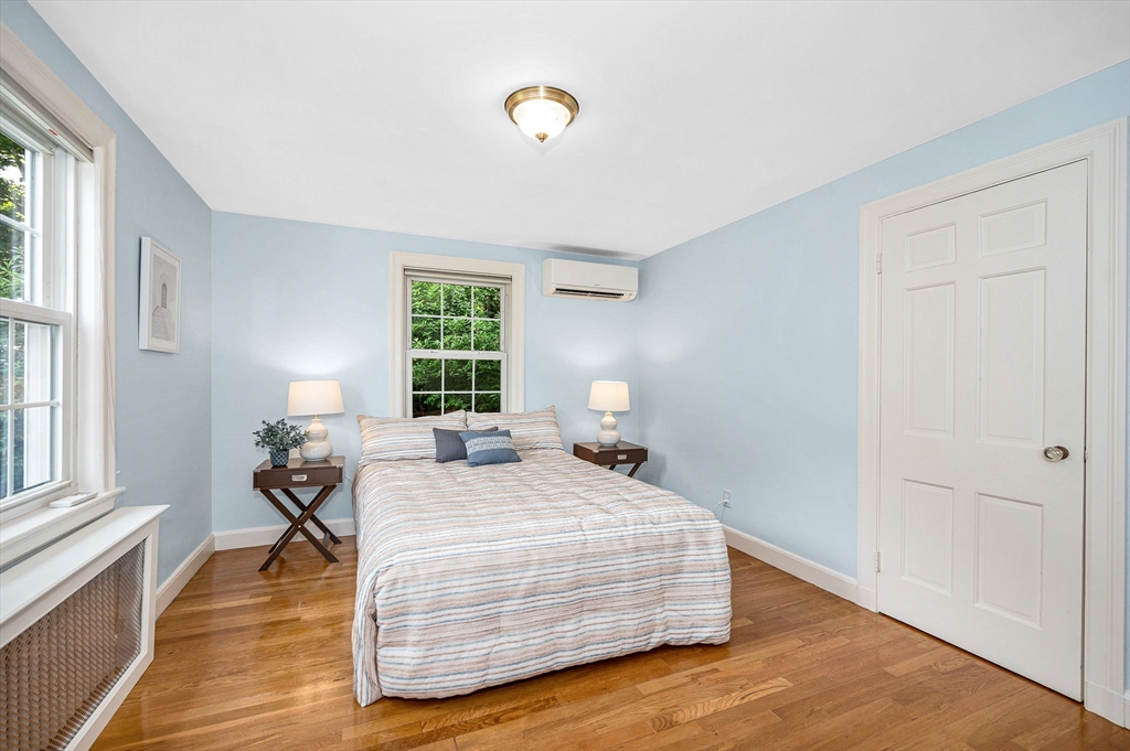 15 Eustis Avenue Wakefield, MA 01880 - Photo 13 of 42 a bedroom with a bed and wooden floor