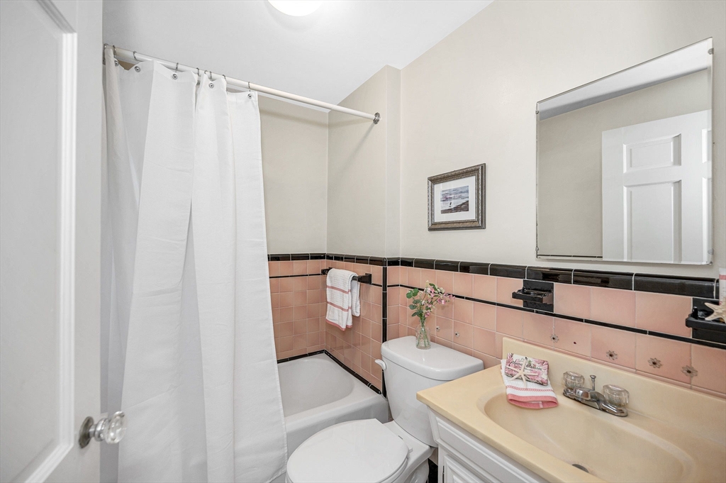 15 Eustis Avenue Wakefield, MA 01880 - Photo 15 of 42 a bathroom with a sink toilet and a mirror