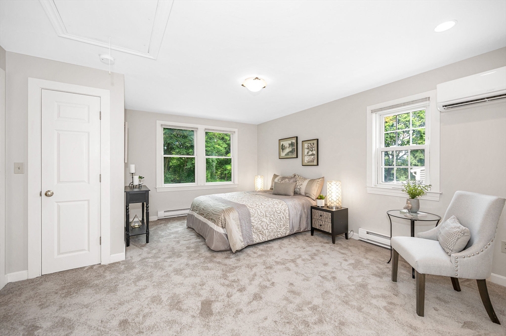 15 Eustis Avenue Wakefield, MA 01880 - Photo 19 of 42 a living room with a bed furniture and a window