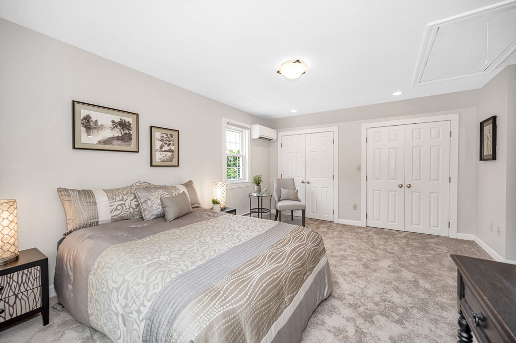 15 Eustis Avenue Wakefield, MA 01880 - Photo 20 of 42 a spacious bedroom with a bed and a cabinets