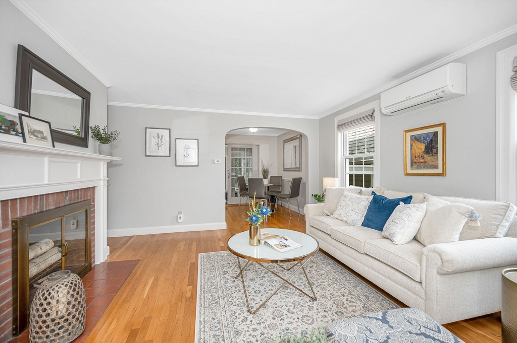 15 Eustis Avenue Wakefield, MA 01880 - Photo 2 of 42 a living room with furniture and a fireplace
