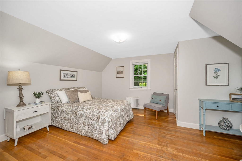 15 Eustis Avenue Wakefield, MA 01880 - Photo 23 of 42 a bedroom with a bed and a couch