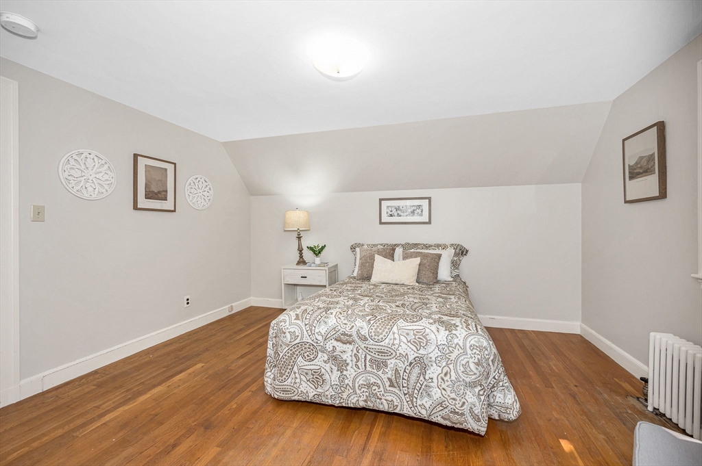 15 Eustis Avenue Wakefield, MA 01880 - Photo 24 of 42 a bedroom with a bed and wooden floor