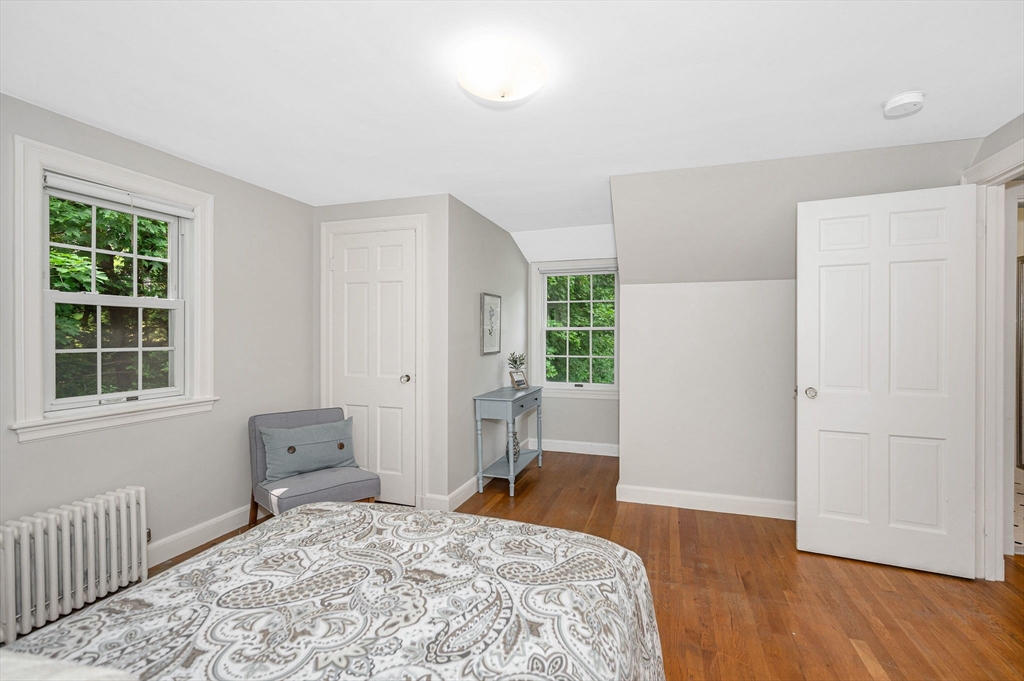 15 Eustis Avenue Wakefield, MA 01880 - Photo 25 of 42 a bedroom with a bed and wooden floor
