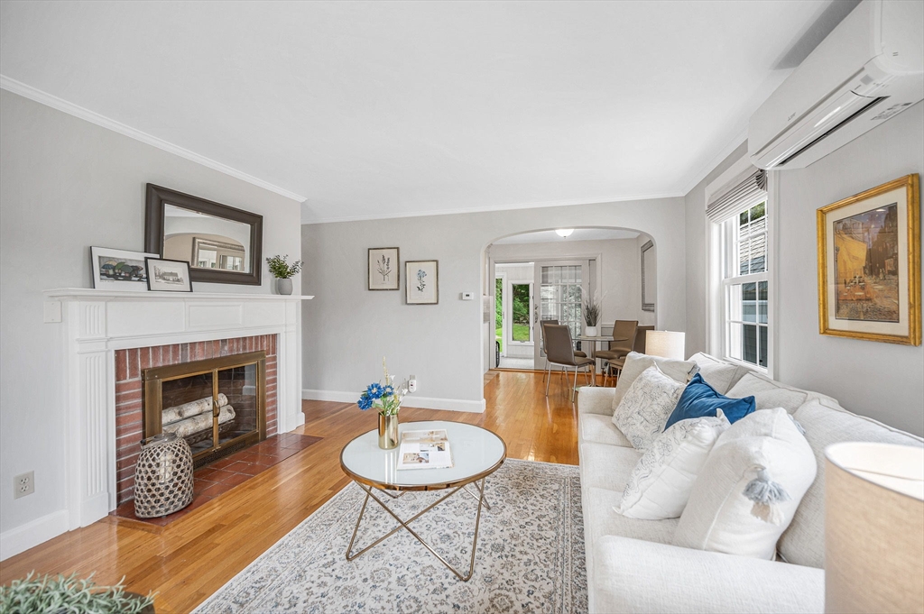 15 Eustis Avenue Wakefield, MA 01880 - Photo 3 of 42 a living room with furniture a fireplace and wooden floor