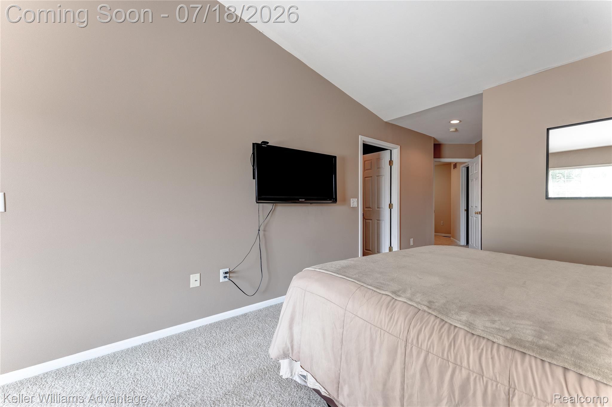 41647 Mitchell Road Novi, MI 48377 - Photo 32 of 43 Interior space featuring vaulted ceilings, light-toned walls, and neutral carpet flooring