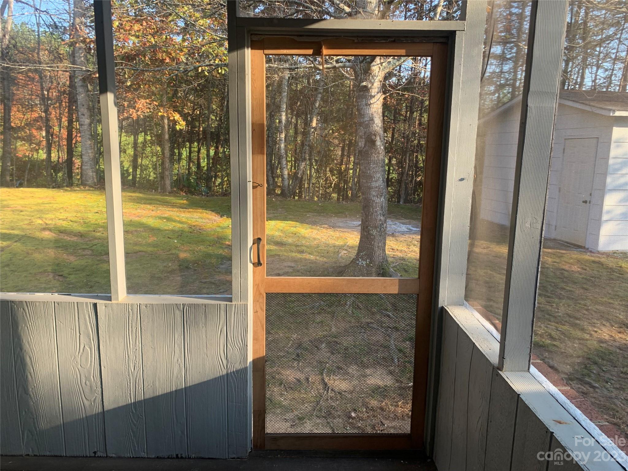100 Owl Hollow Road Mill Spring, NC 28756 - Photo 12 of 29 a view of a glass door with a from a window