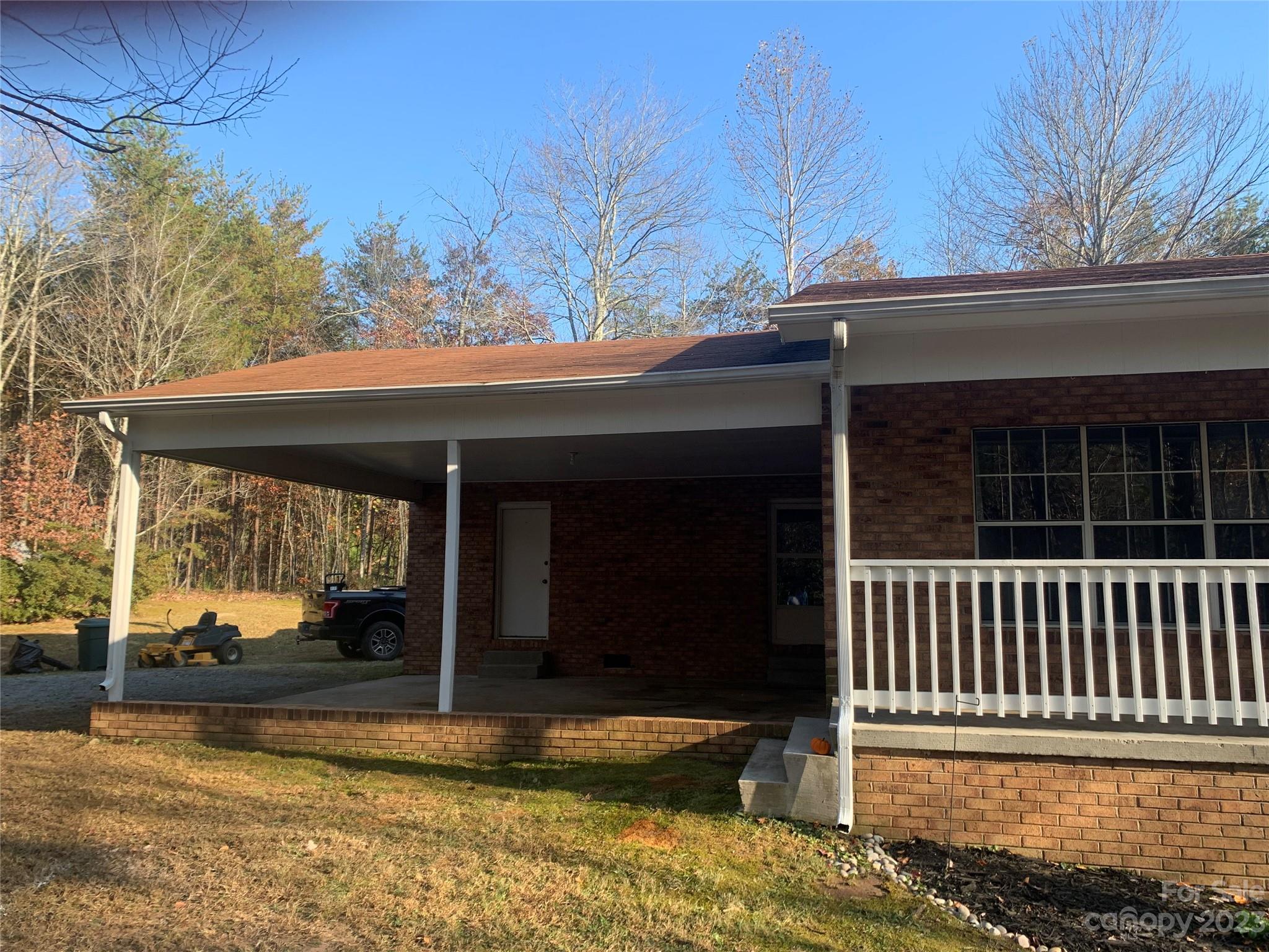 100 Owl Hollow Road Mill Spring, NC 28756 - Photo 2 of 29 a view of a house with a outdoor space