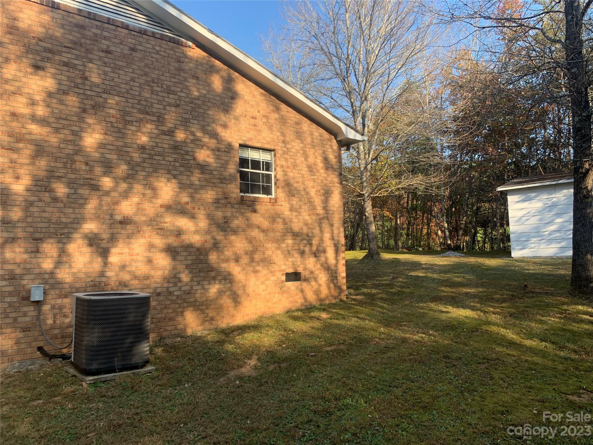 100 Owl Hollow Road Mill Spring, NC 28756 - Photo 4 of 29 a backyard of a house with lots of green space