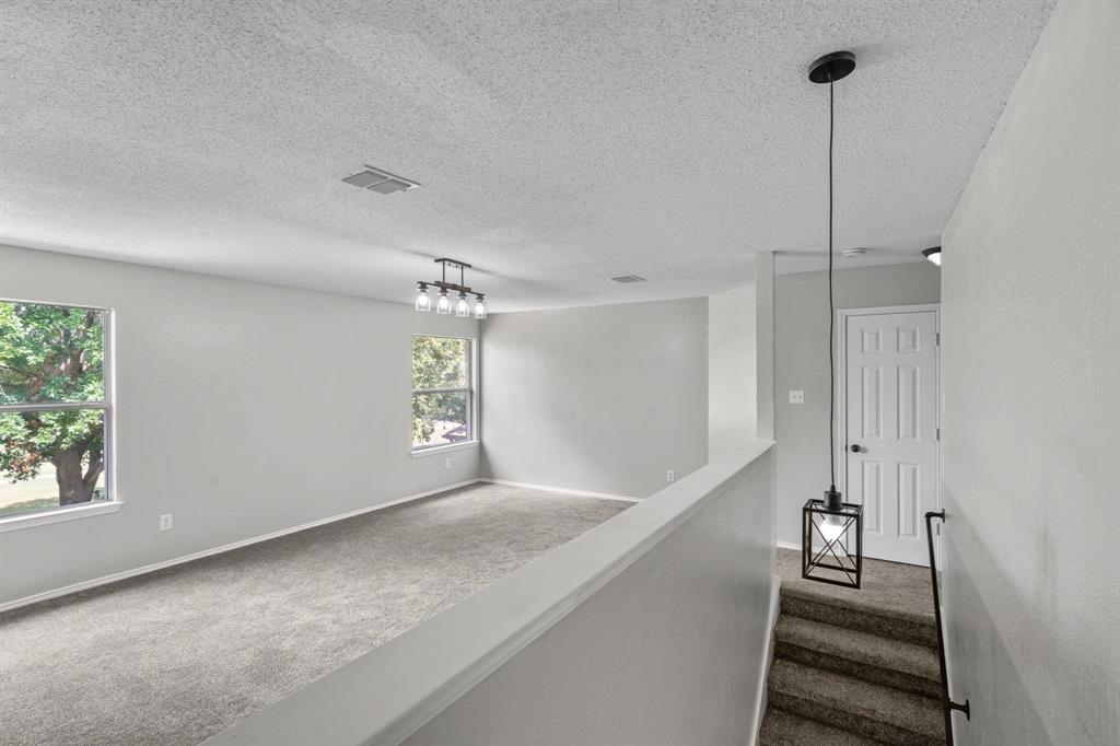 10618 Newcastleton Lane Rowlett, TX 75089 - Photo 7 of 13 a view of an entryway with stairs