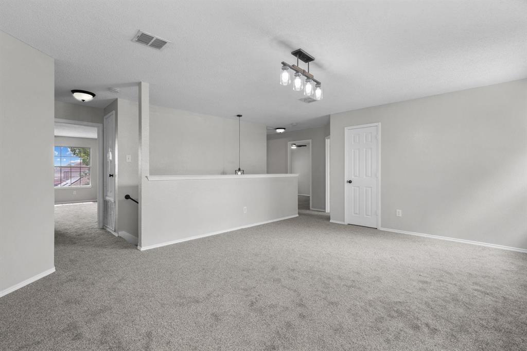 10618 Newcastleton Lane Rowlett, TX 75089 - Photo 8 of 13 a view of an empty room