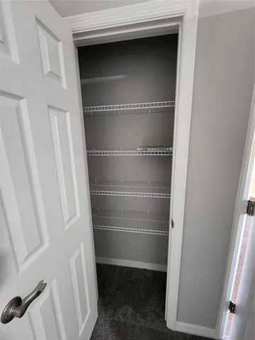 a bathroom with a sink a toilet a mirror and shower curtain