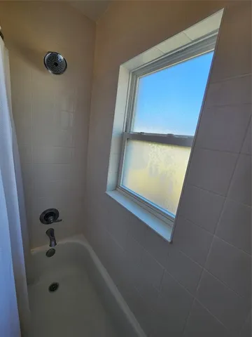 an empty room with a mirror