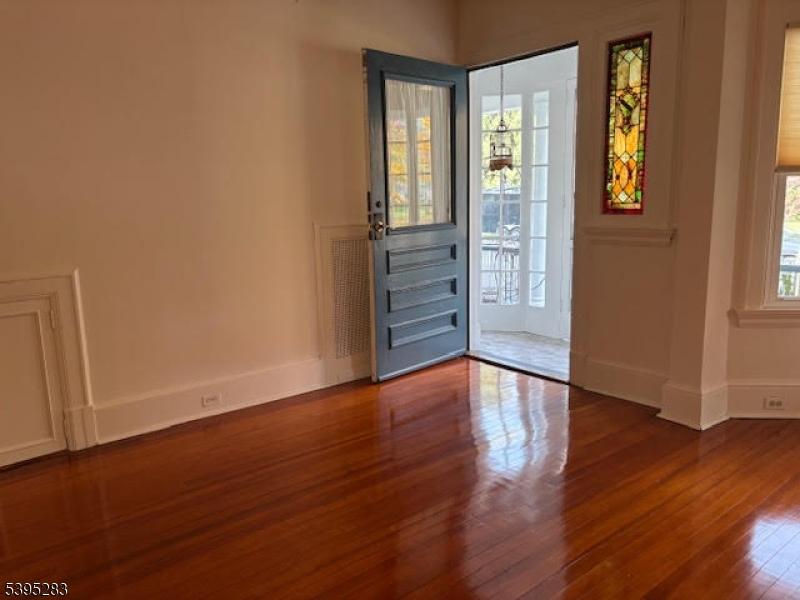 252 Highwood Avenue Ridgewood, NJ 07450 - Photo 4 of 20 an empty room with wooden floor and windows