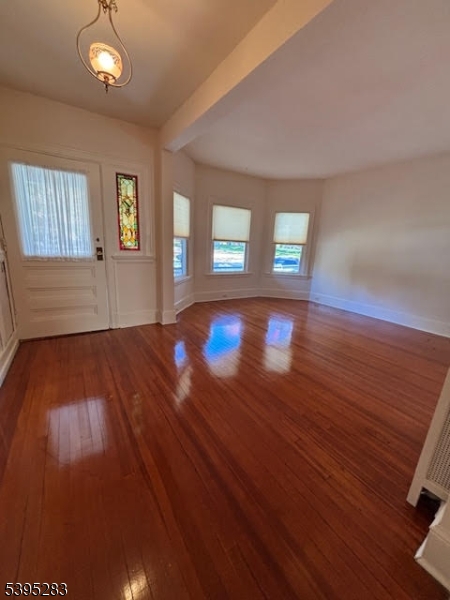 252 Highwood Avenue Ridgewood, NJ 07450 - Photo 6 of 20 a view of empty room with wooden floor and fan