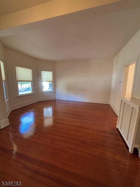 252 Highwood Avenue Ridgewood, NJ 07450 - Photo 7 of 20 wooden floor in an empty room with a window