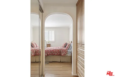 a spacious bathroom with a double vanity sink mirror and bathtub