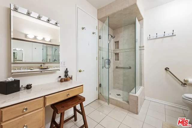 a kitchen with stainless steel appliances kitchen island granite countertop a sink and cabinets