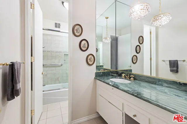 a bathroom with a shower and bathtub