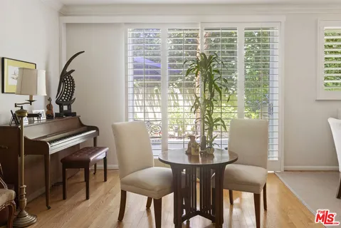 a view of a chair and table in the patio