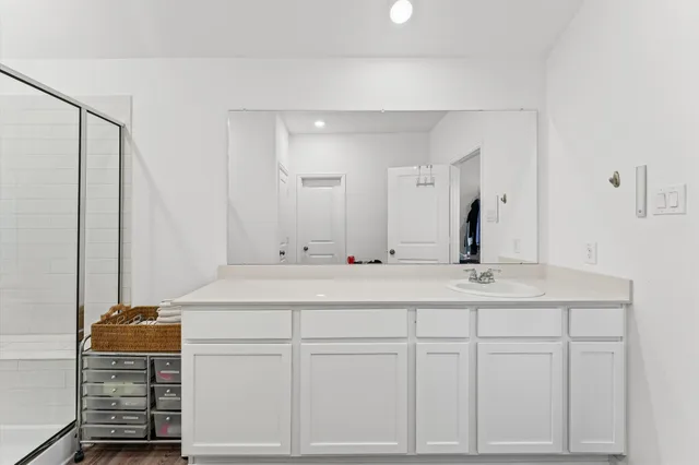 a bathroom with a sink and a mirror