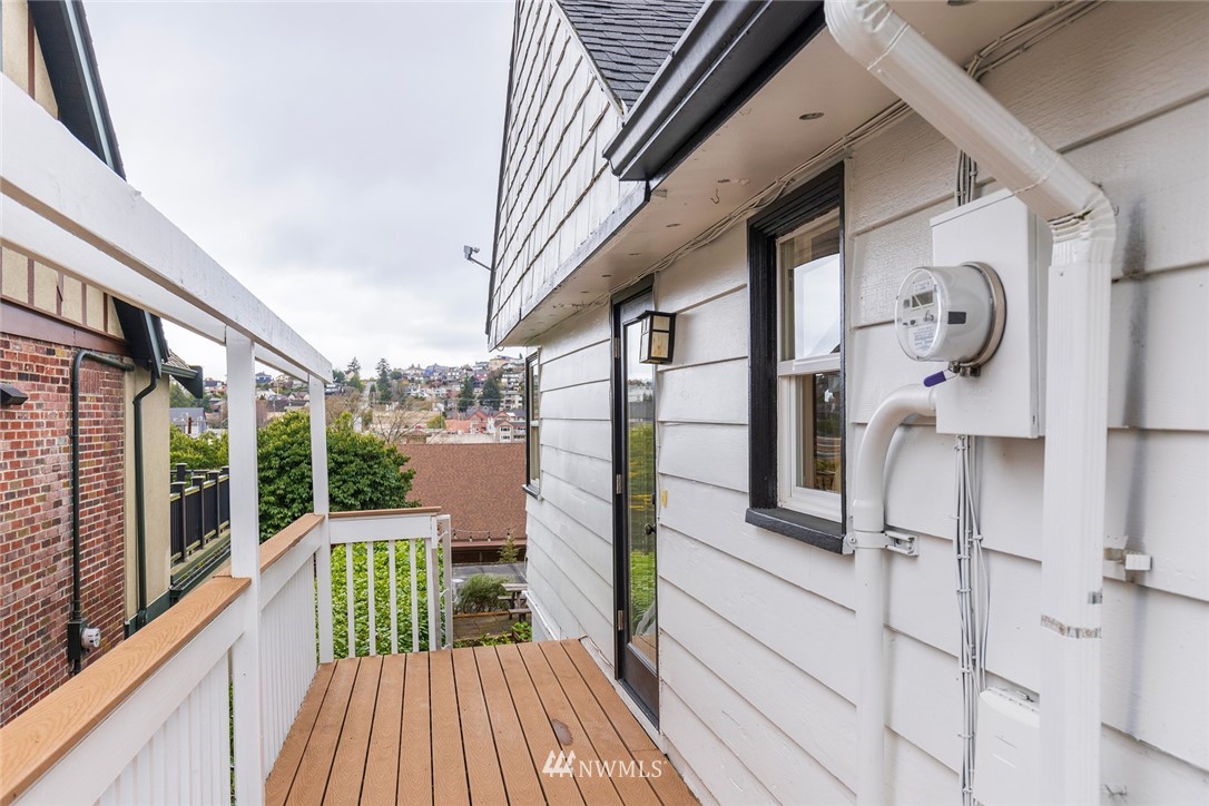 2409 30th Avenue West Seattle, WA 98199 - Photo 11 of 38 a view of a balcony with wooden floor