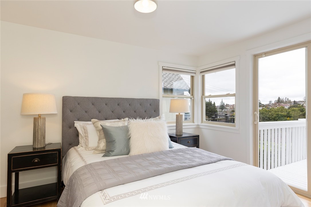 2409 30th Avenue West Seattle, WA 98199 - Photo 12 of 38 a bedroom with a bed and a window