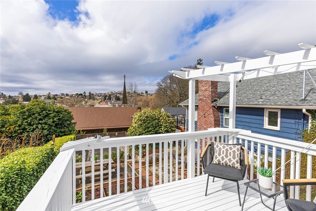 2409 30th Avenue West Seattle, WA 98199 - Photo 17 of 38 a view of a brick building from a balcony