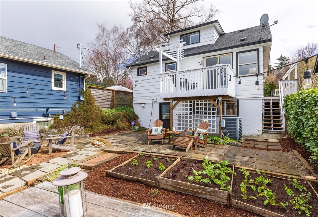 2409 30th Avenue West Seattle, WA 98199 - Photo 30 of 38 a front view of a house with garden