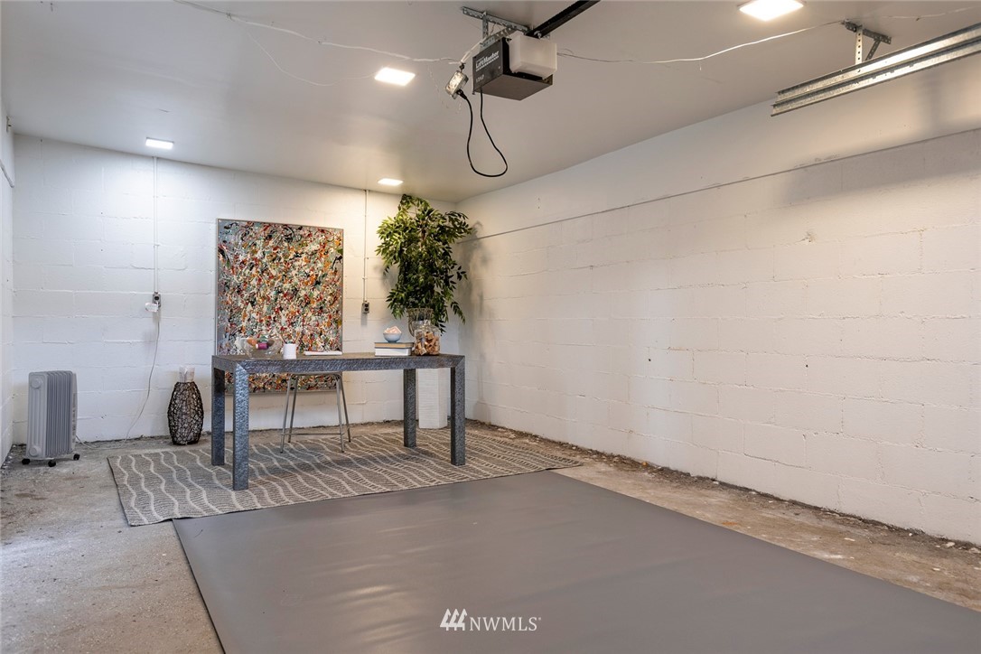 2409 30th Avenue West Seattle, WA 98199 - Photo 33 of 38 a view of a livingroom with furniture and a potted plant