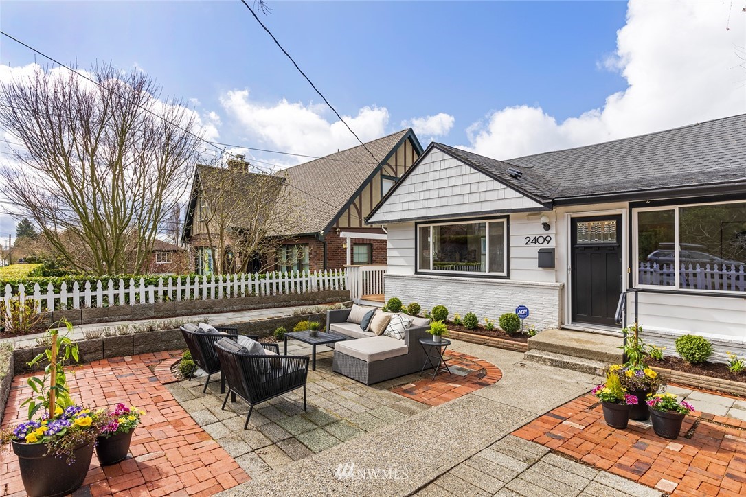 2409 30th Avenue West Seattle, WA 98199 - Photo 35 of 38 a roof deck with couches and potted plants