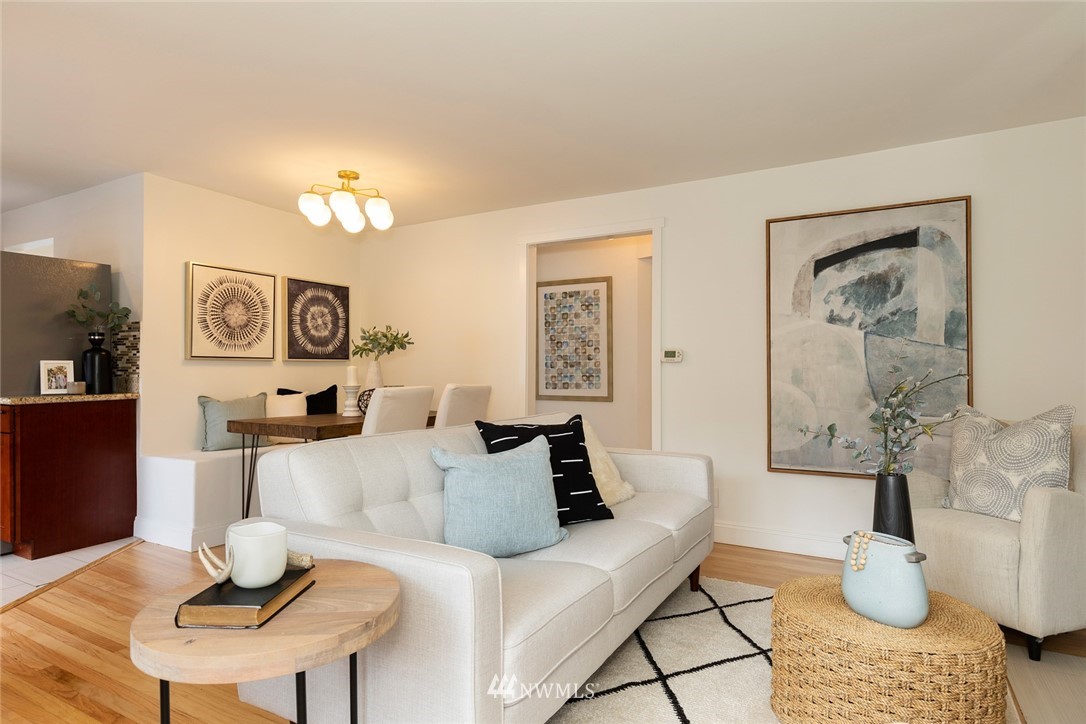 2409 30th Avenue West Seattle, WA 98199 - Photo 6 of 38 a living room with furniture and wooden floor