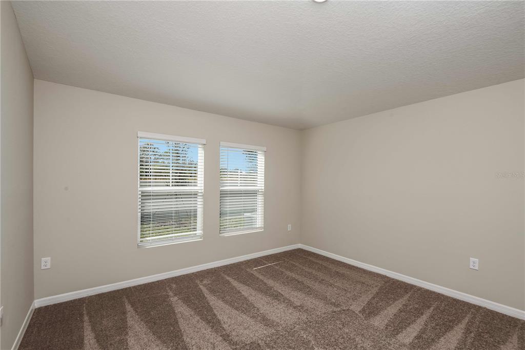 1338 Palmeroy Road Haines City, FL 33844 - Photo 18 of 32 a view of empty room with windows
