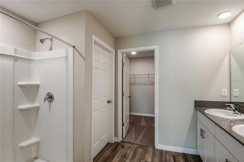 1338 Palmeroy Road Haines City, FL 33844 - Photo 21 of 32 a bathroom with a sink and mirror with toilet